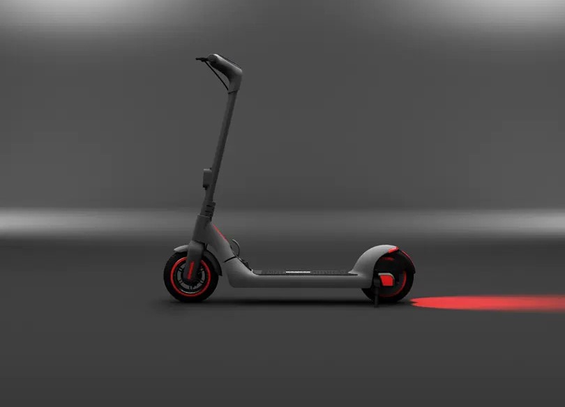 Side view of a Bremer R-Series electric scooter in dark gray, highlighting its sleek design and red wheel accents on a dramatic gray background.
