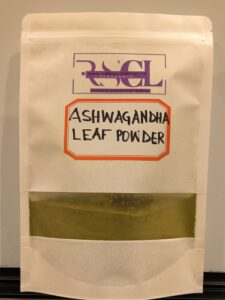 A package of Ashwagandha leaf powder from Rumali Supreme Company LTD, showcasing the green powder through a clear window.