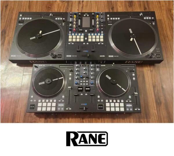 Two Rane DJ controllers, the Rane Twelve and Rane One, displayed side-by-side on a wooden surface, showcasing their large motorized platters and comprehensive control setups.
