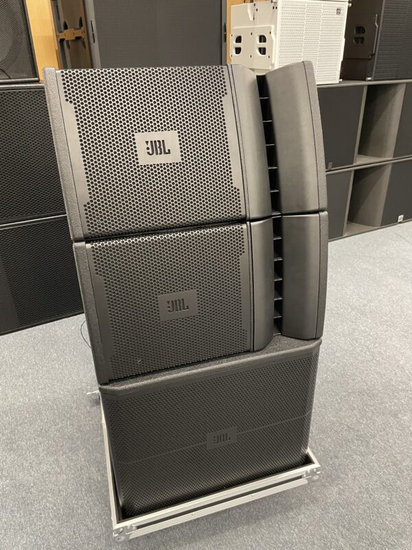 Front view of JBL professional line array speakers stacked on a mobile cart.