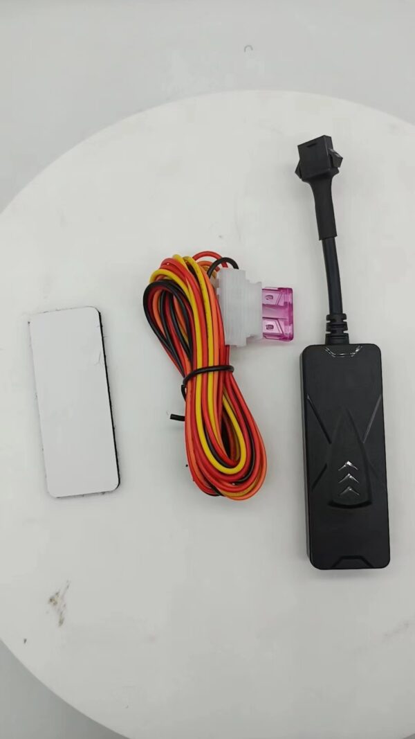GPS TK003 tracking device with wiring harness and magnetic installation feature.